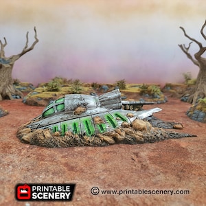 May include: A silver and green spaceship has crashed into the ground, leaving a crater and debris. The spaceship has a green window and is partially buried in the dirt.