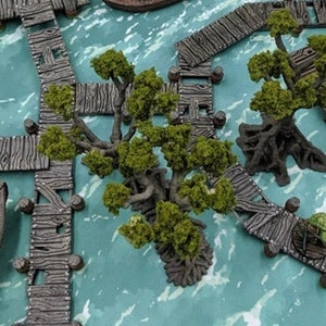 May include: A miniature tabletop gaming set featuring wooden docks, a small boat, and green trees. The set is designed for use with role-playing games.