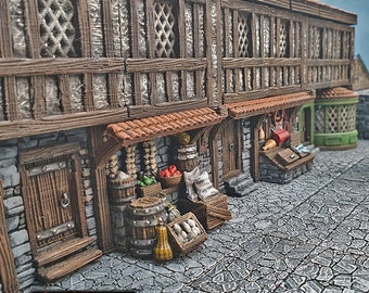 May include: A 3D printed model of a medieval marketplace with three shops. The shops have wooden facades with windows and doors. The shop on the left has a wooden awning and is selling produce. The shop in the middle has a butcher shop sign and is selling meat. The shop on the right is a bakery with a green awning. The shops are on a cobblestone street.
