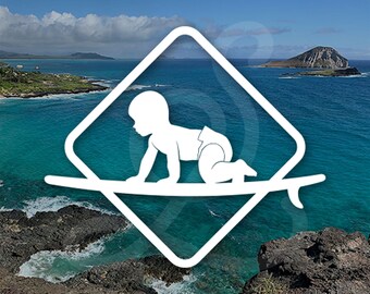 May include: A white graphic logo featuring a silhouette of a baby crawling on a surfboard, centered within a diamond-shaped frame. The logo is overlaid on a scenic coastal view of a turquoise ocean, rocky shoreline, and a distant island under a blue sky.