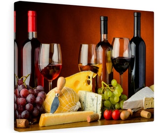 May include: A still life featuring two bottles of red wine, one bottle of white wine, three glasses of wine, a variety of cheeses, grapes, and tomatoes. The cheeses include a round cheese with a netting, a block of cheese, and a wedge of blue cheese.