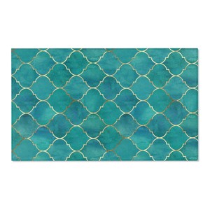 May include: A teal blue and gold geometric pattern with a watercolor effect. The pattern is made up of repeating shapes that resemble quatrefoils.