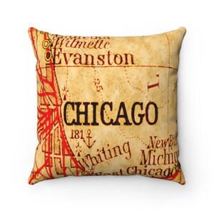 May include: A vintage-style map pillow featuring the word "CHICAGO" in bold red lettering on a beige background. The map shows surrounding areas like Evanston, Whiting, and New Buffalo, Michigan.