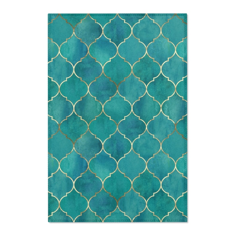 May include: Teal blue and gold geometric pattern with a watercolor effect. The pattern is made up of repeating squares with a quatrefoil design in the center.