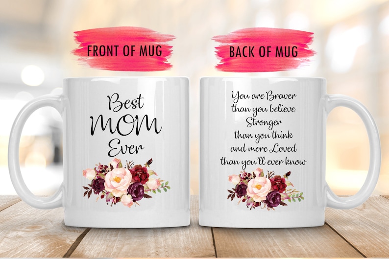 May include: White ceramic mug with the text "Best MOM Ever" and a floral design on the front. The back of the mug has a message that reads "You are Braver than you believe..." A thoughtful gift.