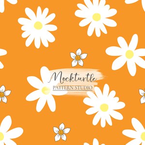 May include: A seamless pattern featuring white daisies with yellow centers on a bright orange background. The text "Mockturtle Pattern Studio" is written in black on a white brushstroke.