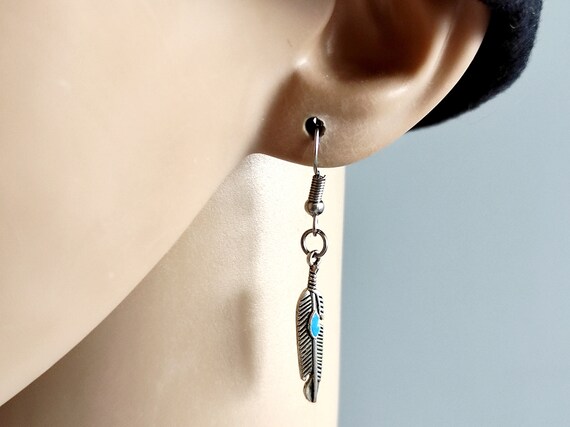 Mens feather earring meaning clearance