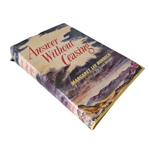 May include: A vintage hardcover book titled "Answer Without Ceasing" by Margaret Lee Runbeck, author of "The Great Answer". The book cover features a watercolor-style illustration of a cloudy sky and mountains.