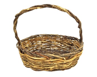 May include: A woven basket with a natural brown and tan color. The basket has a single handle and is made of thin twigs.