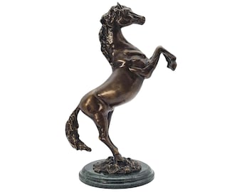 May include: A bronze sculpture of a rearing horse. The horse is depicted with its front legs raised, showcasing its muscular form. The sculpture is mounted on a round, green marble base, adding a touch of elegance to the piece.