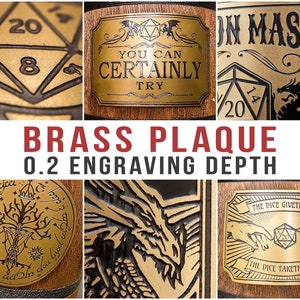 May include: A close-up of six different brass plaques with various designs, including a dragon, a tree, a dice, and a hand reaching towards a dice. The plaques are engraved with the text "You Can Certainly Try", "Dragon Master", and "The Dice Giveth and The Dice Taketh Away". The plaques are 0.2 inches deep.