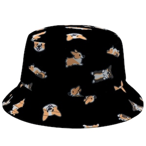 May include: Black bucket hat with a pattern of cartoon corgis in various poses. The corgis are brown, white, and black.