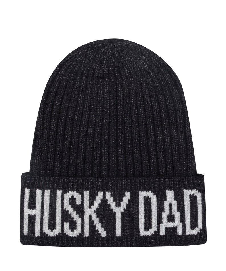 May include: Black knitted beanie with a white "HUSKY DAD" embroidered on the cuff.