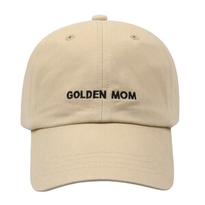 May include: A beige baseball cap with black embroidery that reads "GOLDEN MOM".