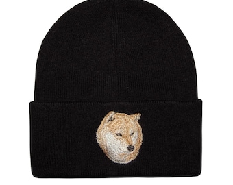 May include: Black knit beanie with a brown and white embroidered Shiba Inu dog face.