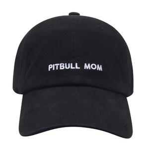 May include: A black baseball cap with white embroidered text that reads "PITBULL MOM".