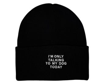 May include: Black beanie with the white text "I'M ONLY TALKING TO MY DOG TODAY". The beanie is a classic, cuffed style, perfect for cold weather. The text is centered on the cuff.