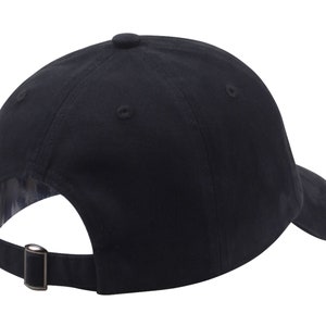 May include: A black baseball cap with a curved brim and an adjustable strap.