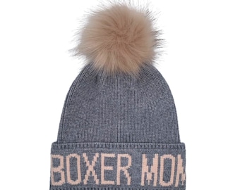May include: Gray knit beanie with a fluffy pom pom on top and the words "BOXER MOM" in pink lettering on the cuff.