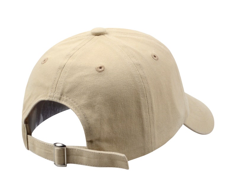 May include: A beige baseball cap with a curved brim and an adjustable strap. The cap has a classic design and is made of a soft, comfortable fabric.
