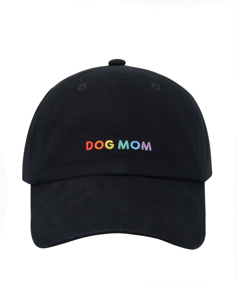 May include: A black baseball cap with the words "DOG MOM" embroidered in rainbow colors.