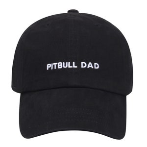 May include: Black baseball cap with white embroidered text that reads "PITBULL DAD".
