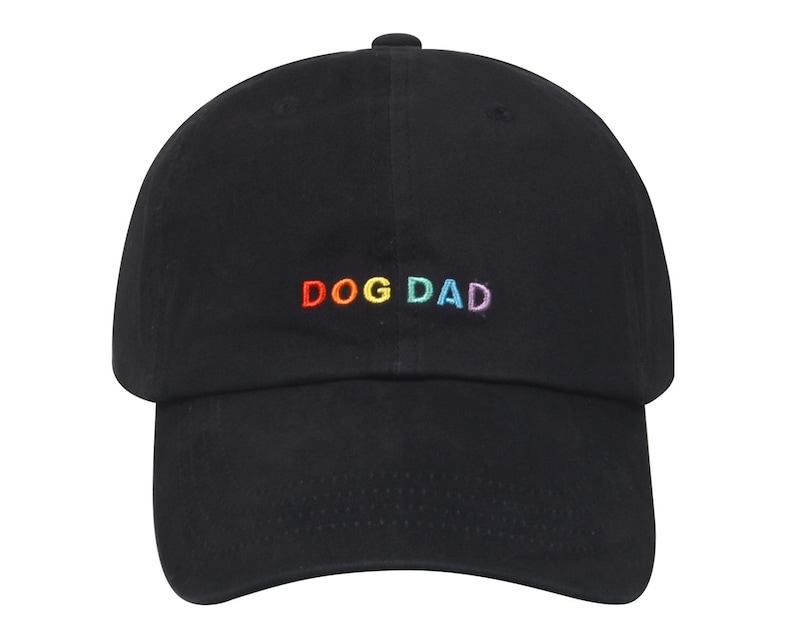 May include: Black baseball cap with a rainbow embroidered "DOG DAD" text.