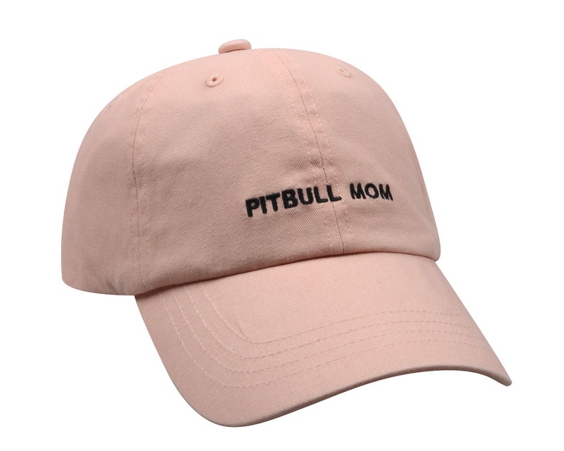 May include: A pink baseball cap with black embroidery that reads "PITBULL MOM".