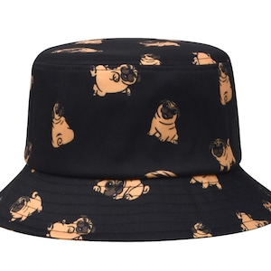 May include: Black bucket hat with a pattern of brown pugs on a white background.