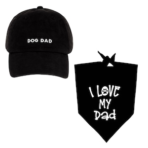 May include: Black baseball cap with the text "DOG DAD" embroidered in white. A black bandana with a white paw print and the text "I LOVE MY DAD" in white.
