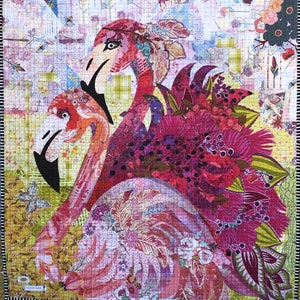 May include: A colorful quilt featuring two pink flamingos with intricate floral patterns and a green and yellow background.
