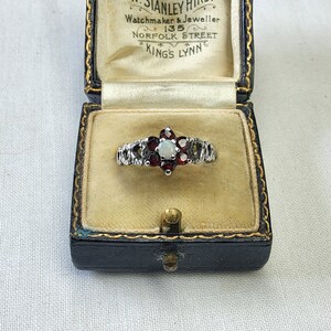 Beautiful Art Deco, Antique, Woman's Silver, Natural Garnet and Natural Snow Opal Floral Ring.