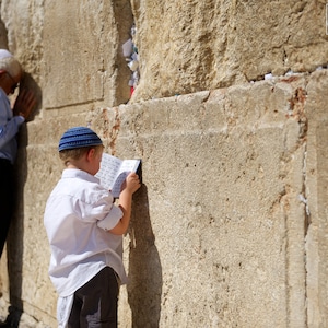 Child Praying at the Wall