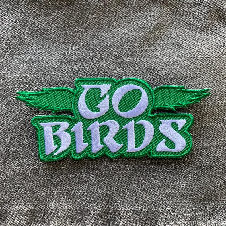 May include: Green and white embroidered patch with the words "GO BIRDS" and a green bird wing design.