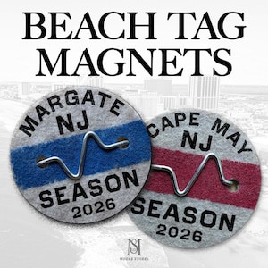 May include: Two circular beach tag magnets featuring the text MARGATE NJ and CAPE MAY NJ with the year 2026. The Margate tag has a blue horizontal stripe, while the Cape May tag has a red stripe. Both include a silver metal wire attachment.