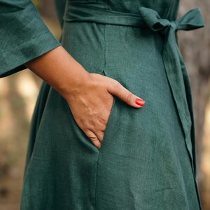 Green linen wrap dress for bridesmaids close up of a pocket