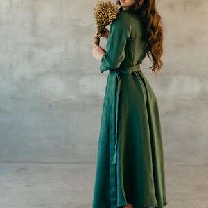 Dark green long sleeve linen wrap dress, full length front view
