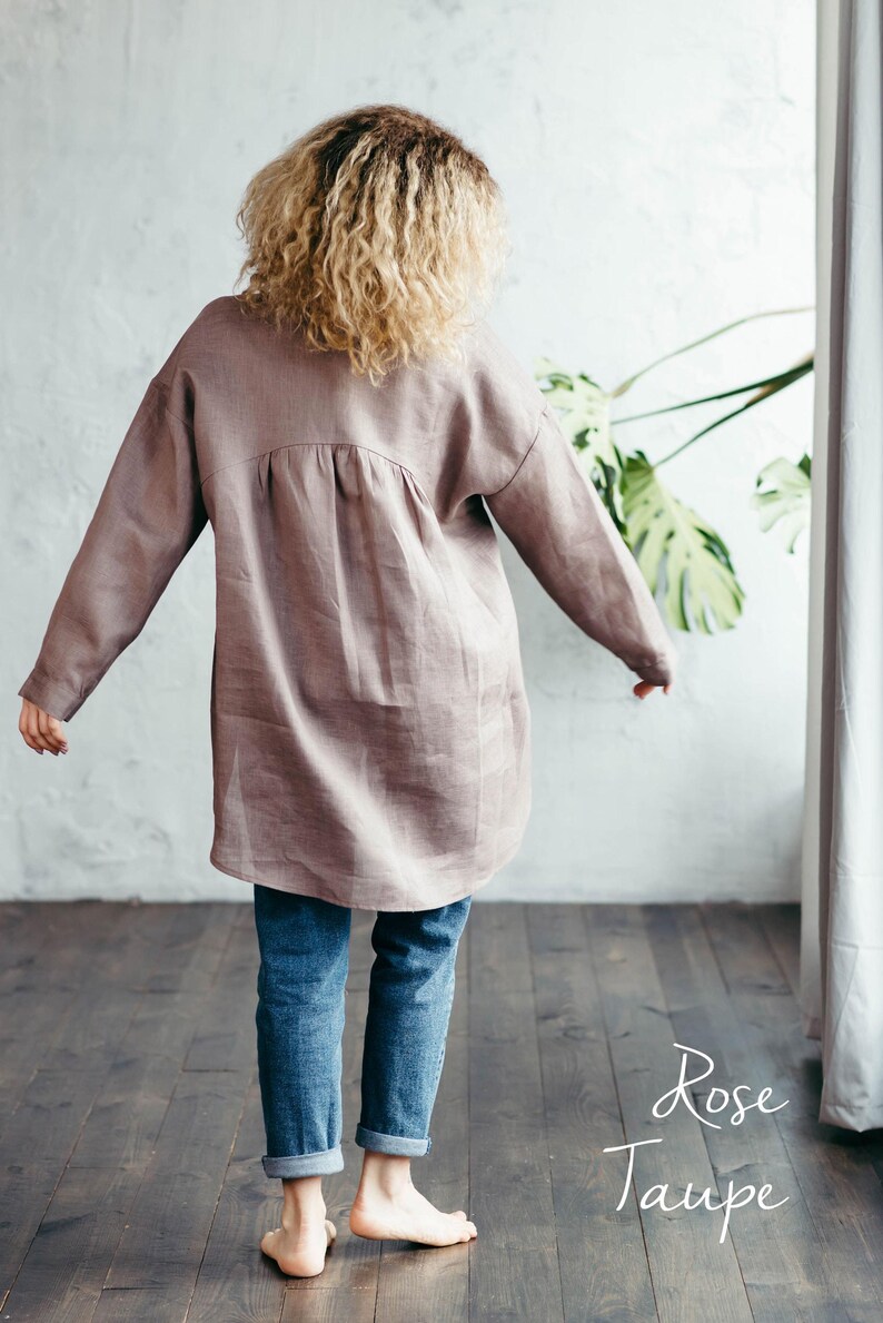 Back view of the rose taupe natural linen shirt with long sleeves, showcasing its immaculate construction, clean lines, and stylish design.