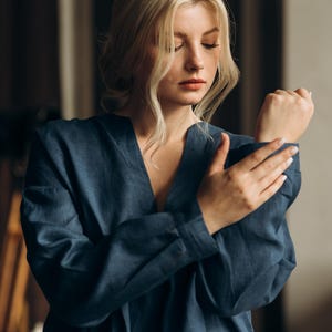 Coastal Blue linen shirt women café lifestyle back view