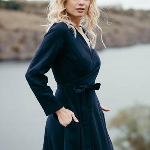 Navy linen wrap summer dress, side view showing pocket and belt tie detail