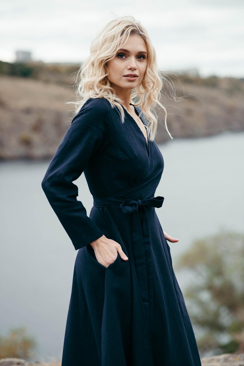 Navy linen wrap summer dress, side view showing pocket and belt tie detail