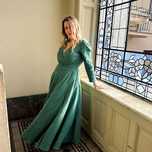 Green linen wrap dress by ornate stained glass window