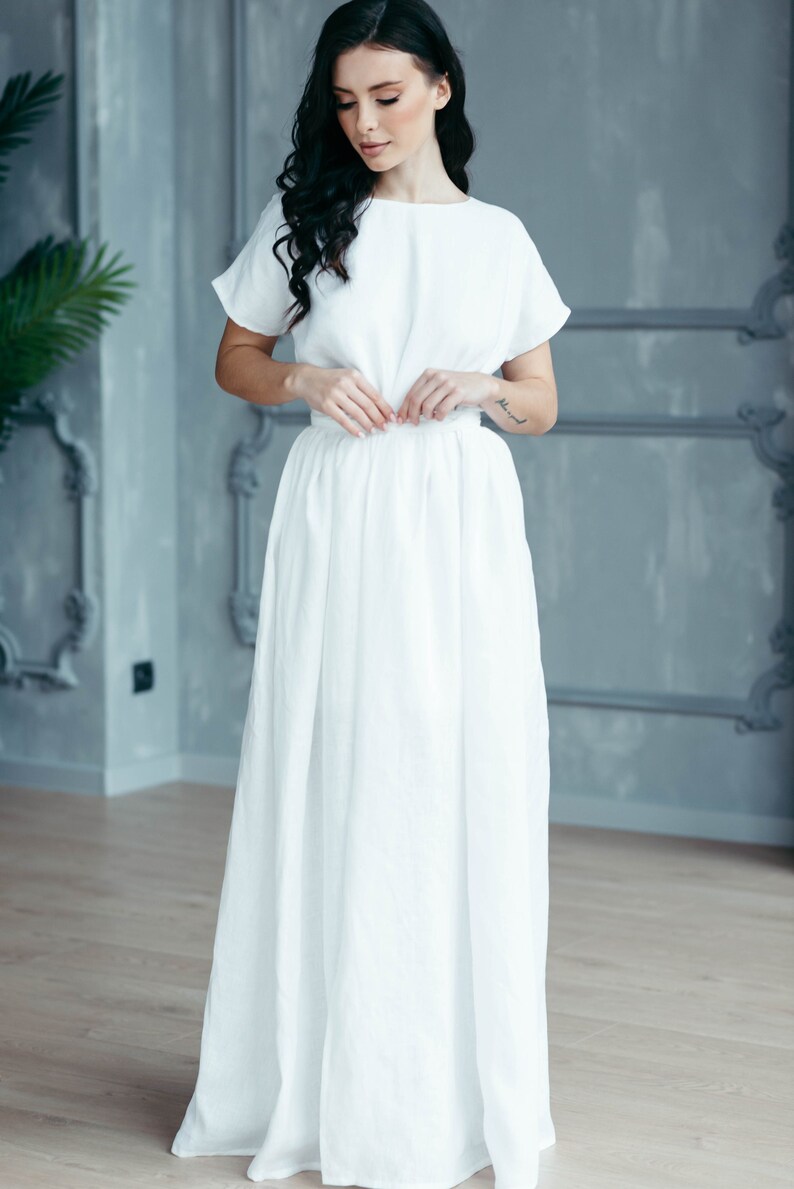 Linen wedding dress, twirling shot showing front slit