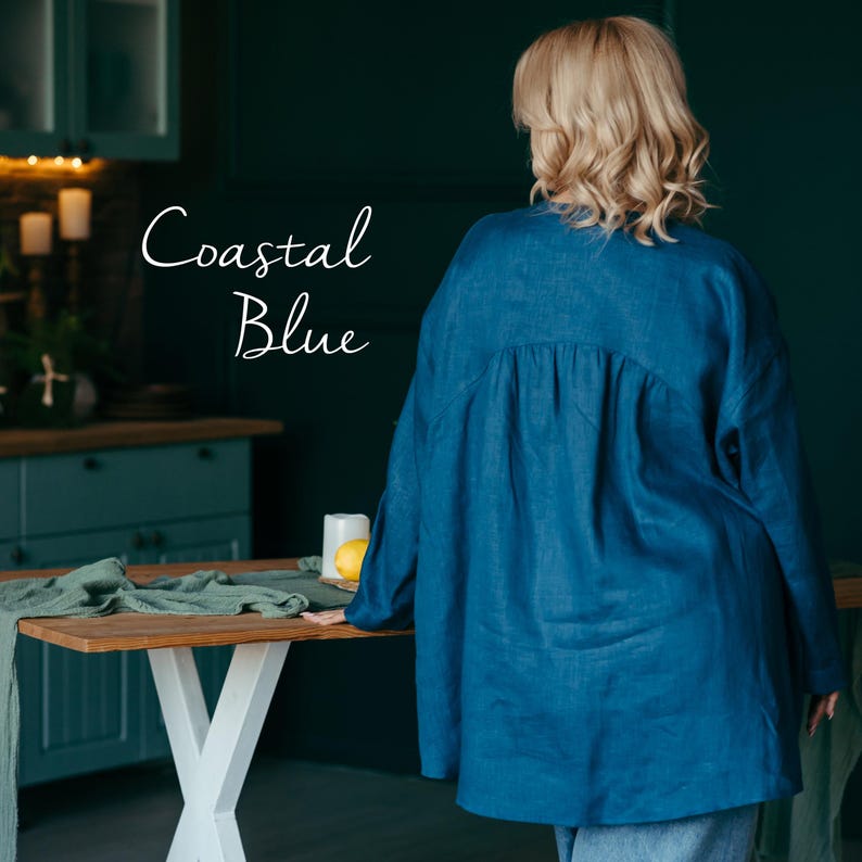 Back view of the coastal blue pure linen shirt, emphasizing clean tailoring and modern simplicity.