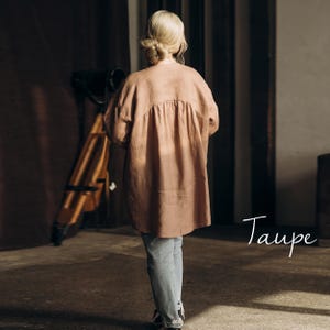 Back view of the taupe 100% linen summer shirt for women, highlighting its tailored construction and smooth finish.