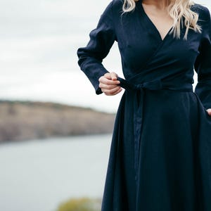 Navy linen wrap dress, front view showing adjustable wrap waist