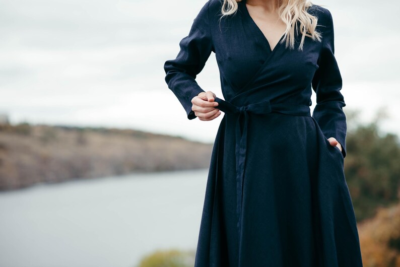 Navy linen wrap dress, front view showing adjustable wrap waist