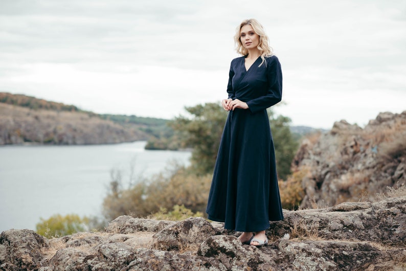 Navy linen wrap dress, full length by lakeside, natural light