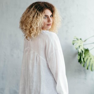 White linen blouse back view asymmetric hem detail
