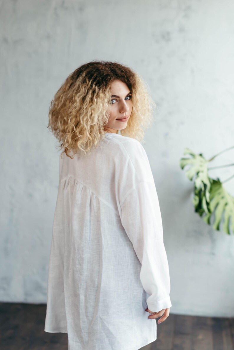 White linen blouse back view asymmetric hem detail